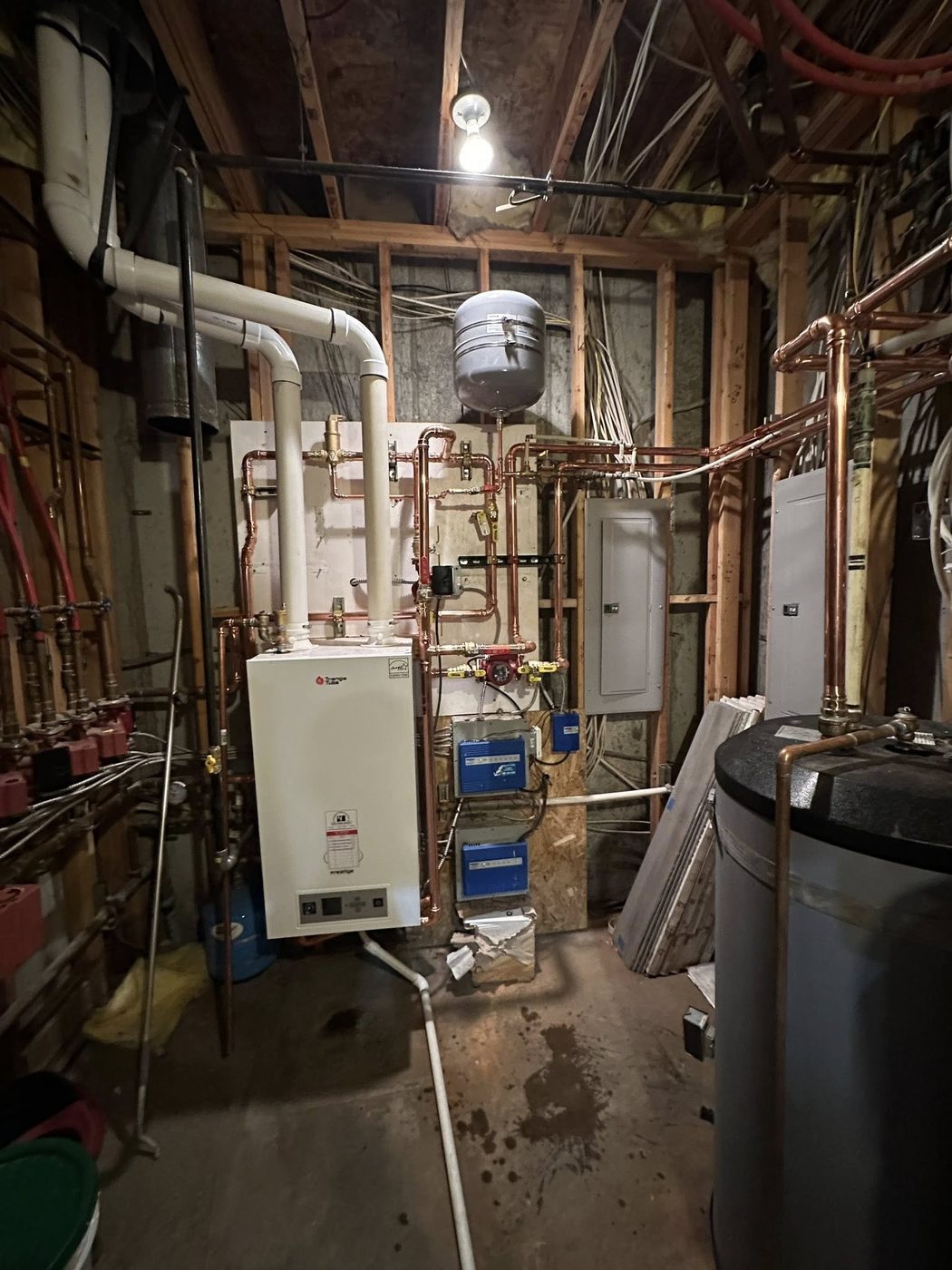 Triangle Tube boiler installation with copper distribution manifold and zone controls
