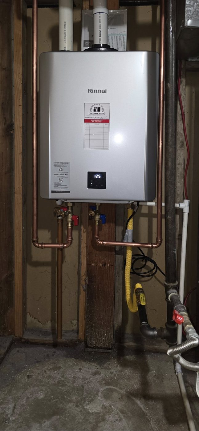 Rinnai tankless water heater installation with copper supply lines, shut-off valves, and gas connection